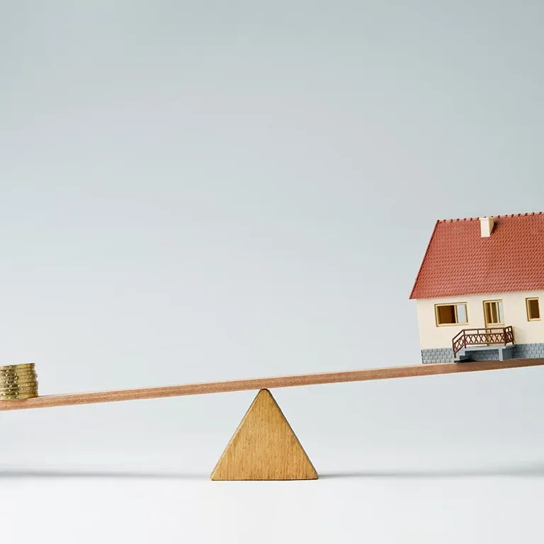 Wip-wap met geld en huis
